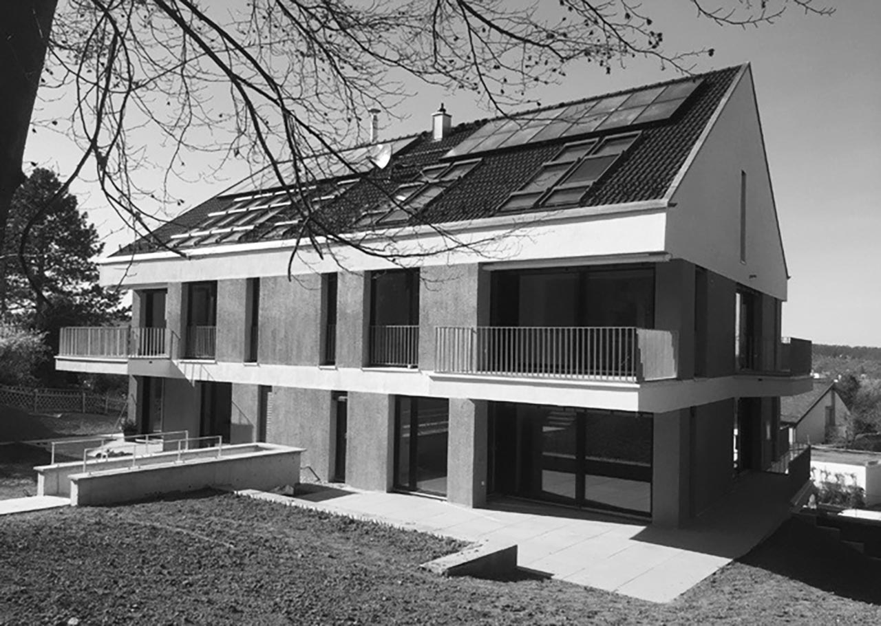Baukörper in klarer Kubatur mit zurückhaltender Materialität